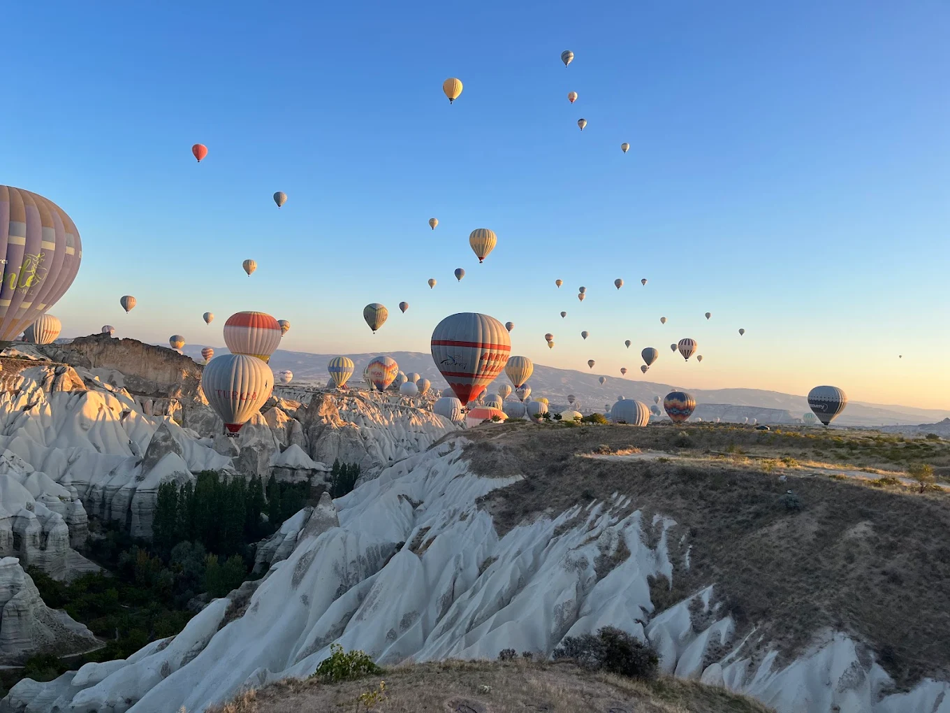 Cappadocia balloon flight over Göreme valleys during golden sunrise season 2026